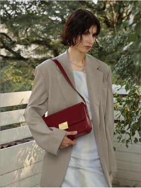 A. Cloud Book Lock Baguette Bag in Burgandy